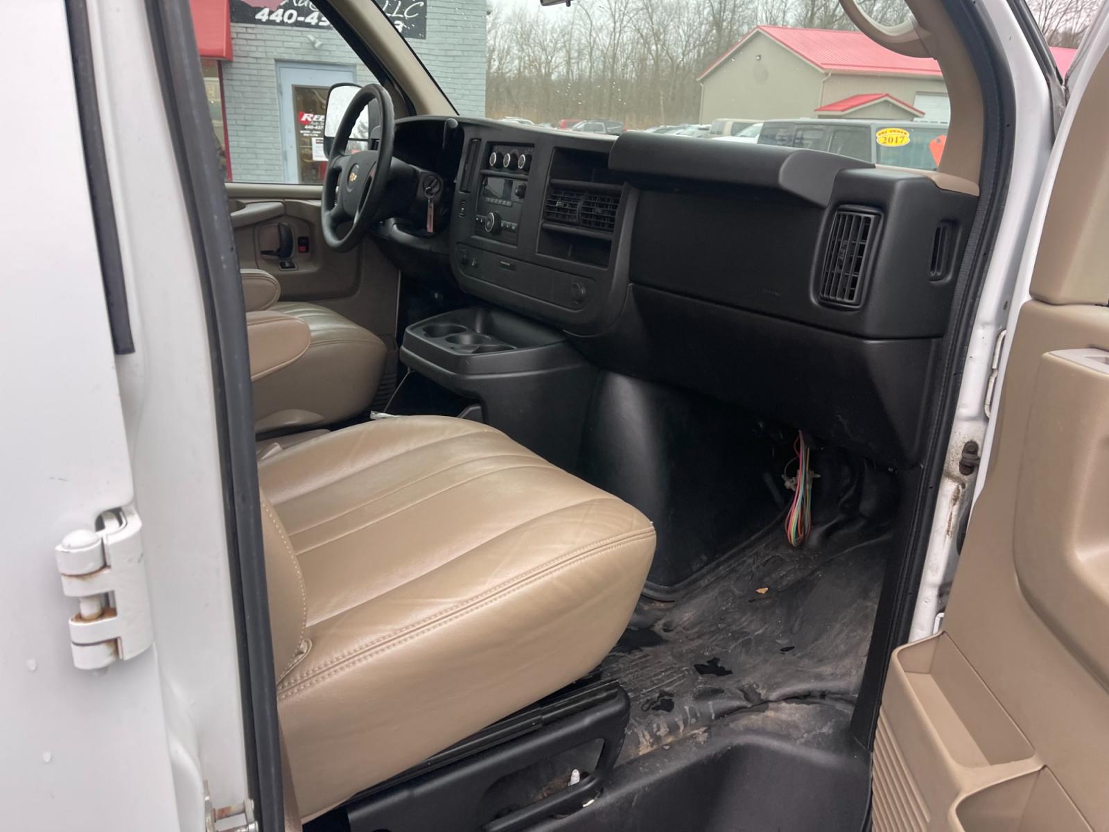 2014 White /Neutral Chevrolet Express 1500 AWD Cargo (1GCSHAF4XE1) with an 5.3L V8 OHV 16V FFV engine, 4-Speed Automatic transmission, located at 547 E. Main St., Orwell, OH, 44076, (440) 437-5893, 41.535435, -80.847855 - This 2014 Chevrolet Express 1500 Cargo Van with a 5.3L Vortec V8 engine and all-wheel drive is a versatile and robust vehicle designed to meet various transportation and towing needs. It comes equipped with convenient features such as power windows, power locks, and a backup camera for safer reversi - Photo #36